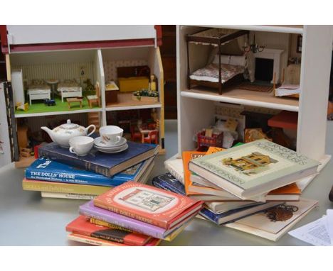A small painted wooden doll's house, 20th century, the four rooms fully furnished; together with a display case of three shel