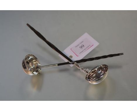 A George III silver toddy ladle, London 1802, with oval bowl and twisted whalebone handle; together with a smaller Victorian 