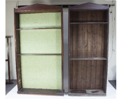 A near pair of 19th Century mahogany alcove bookcases with architectural pediments, one 111cm wide, the other 88cm wide