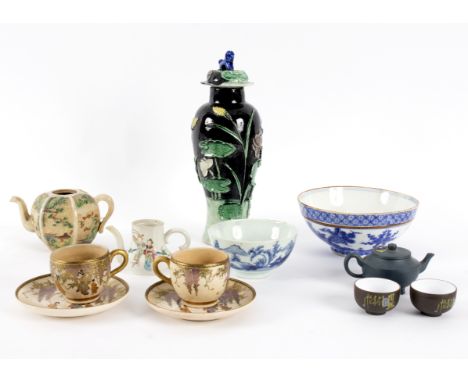 A group of Oriental porcelain and pottery to include two Satsuma coffee cups and saucers, a Chinese 19th Century teapot with 