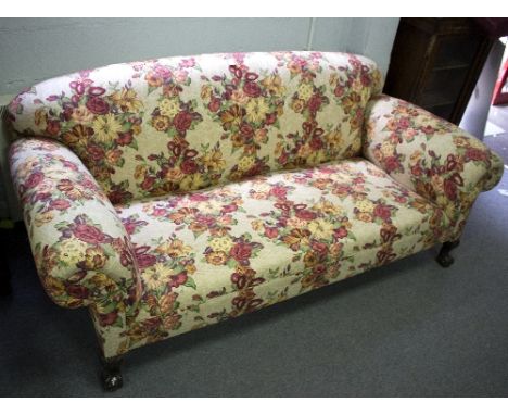 An upholstered sofa, on ball and claw feet, 210cm wide