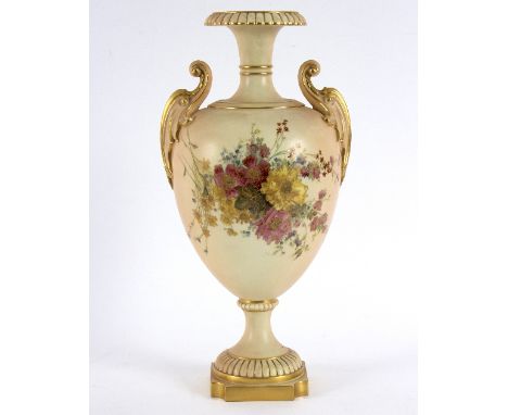 A Royal Worcester blush ivory oviform pedestal vase with scroll handles, painted and decorated bouquets of flowers in colour 