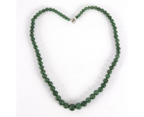 A single row of graduated jade beads, 73cm long