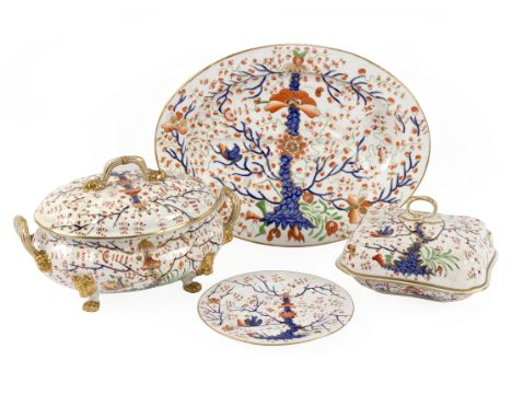 An extensive Derby dinner service, early 19th Century, painted in the Imari palette with prunus branches, comprising two soup