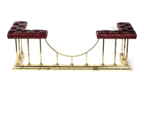 A club fender, the button upholstered top on gilt metal supports, 153cm wide x 53cm deep