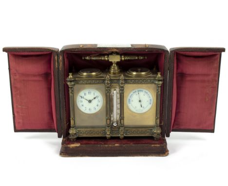 An Edwardian clock/barometer, in a gilt brass case, with central thermometer and compass to the top, 15cm high, in a fitted l