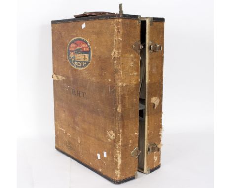 A canvas covered travelling trunk containing a quantity of various lady's vintage shoes, mostly size 5, each within a fitted 