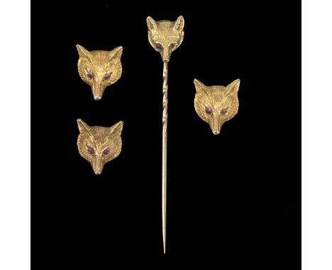 A 9ct gold fox mask stick pin and three similar dress buttons, approximately 9.5gm/see illustration