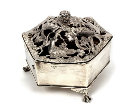 A silver pot pourri, London 1906, of hexagonal form, with pierced hinged cover decorated hummingbirds and parrots within foli