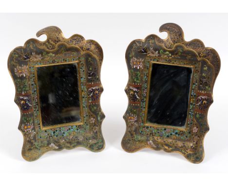 A pair of brass and enamel strut mirror frames, decorated birds, flowers and foliage, 20 cm wide (2)  See illustration