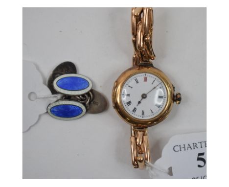 A lady's 9ct gold wristwatch, and a pair of silver and enamel cufflinks (2)