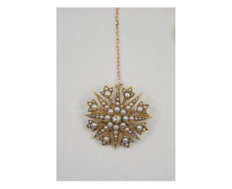 A seed pearl star brooch, set a central diamond, in a Gieves Ltd box