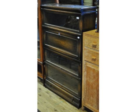 A Globe Wernicke oak secretaire bookcase, with a drawer below, 86 cm wide