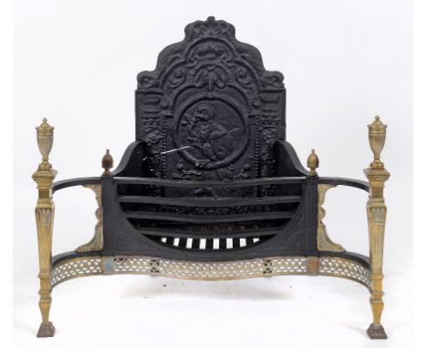 A George III style iron and brass serpentine front grate, with vase turned finials, 95 cm wide