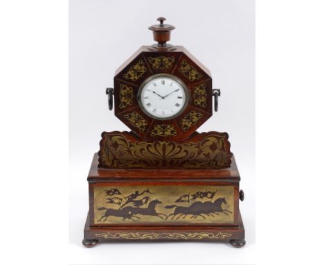 A mantel clock, the white enamel dial with Roman numerals, the movement signed E Moore London, in a rosewood case, with brass