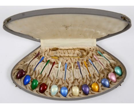 A set of twelve Scandinavian silver gilt and enamel harlequin teaspoons, with matching sugar tongs, in a J Tostrup Oslo case 
