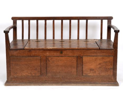 A 19th century farmhouse box settle, 161 cm wide  See illustration Condition report Report by GH

One rear slat missing.  Oth