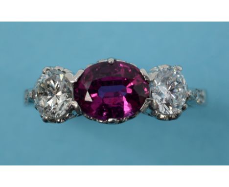 A ruby and diamond ring, in a white coloured metal setting, approx. ring size M½  See inside front cover colour illustration