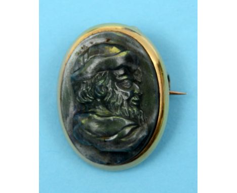 A labradorite cameo brooch, carved a bust portrait of a gentleman in profile, in a 15ct gold mount  See front cover colour il