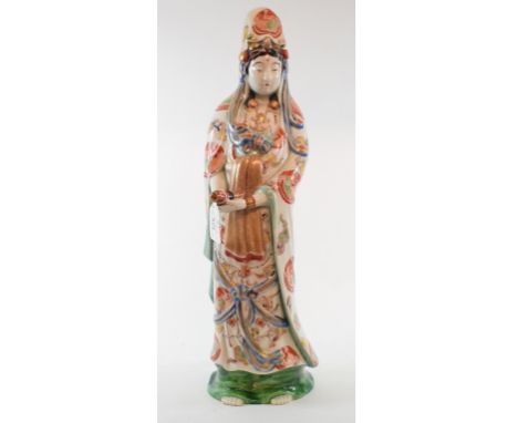 A Chinese figure, of a sage holding a scroll, 47 cm high