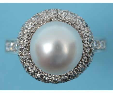 A large platinum, pearl and diamond cluster ring, approx. ring size U  See illustration