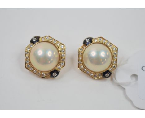 A pair of 18ct gold and blister pearl clip earrings, in a diamond and onyx set mount Condition report Report by NG

Appears t