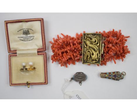 A micro mosaic brooch, a Chinese style coral bracelet, a gilt metal and enamel Egyptian type sarcophagus, and other items