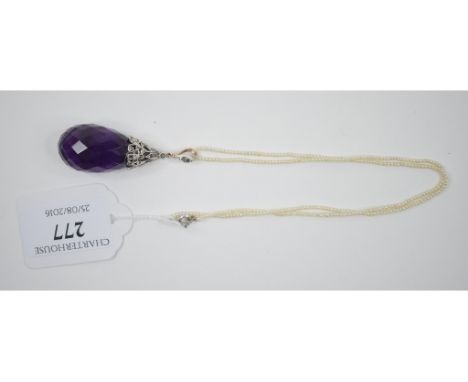 A large faceted amethyst teardrop pendant, with white coloured metal mounts, set diamonds, on a seed pearl chain