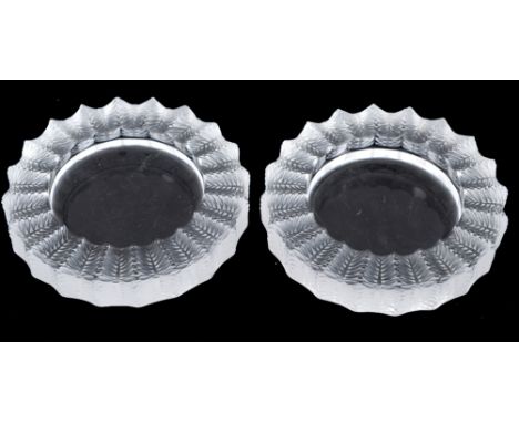 A pair of Lalique circular glass ashtrays or dishes, 14 cm diameter (2)  See illustration Condition report Report by GH

One 