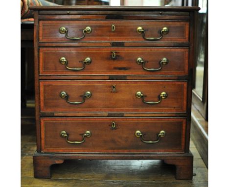An inlaid mahogany chest, with brushing slide above four long drawers, on bracket feet, 75 cm wide Condition report Report by