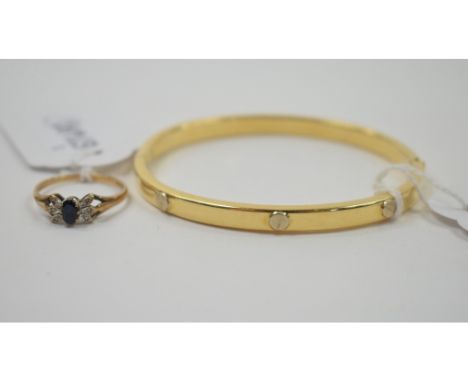 A Cartier style 18ct gold bangle, approx. 13.2 g, and a 9ct gold ring (2)