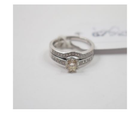 A platinum and solitaire diamond ring, with diamond set shoulders, approx. ring size K½, and a platinum and diamond set weddi