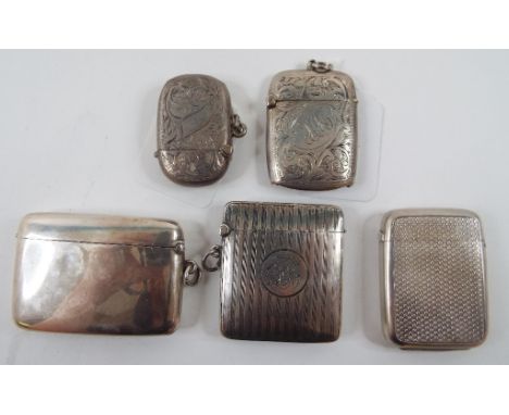 A silver vesta case, with engine turned decoration, Birmingham 1885, and four others, approx. 4.4 ozt (5)