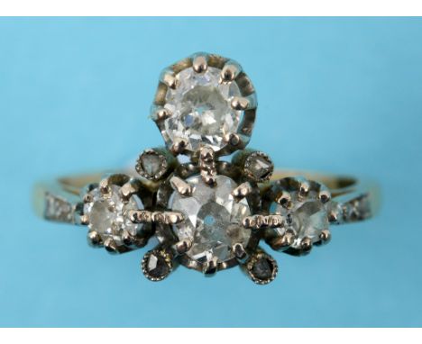 A diamond ring, in a T shaped yellow coloured metal setting, approx. ring size K  See inside back cover colour illustration