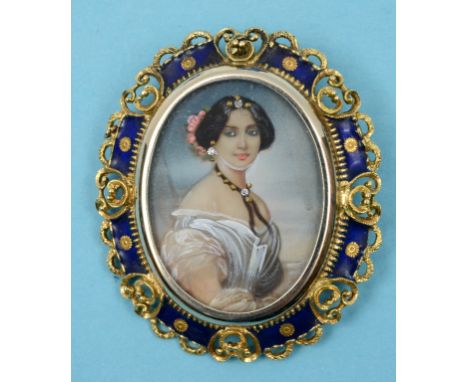 An oval portrait miniature, of a lady, set diamonds, in an 18ct gold and enamel pendant mount    See front cover colour illus