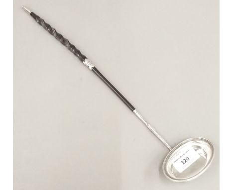 An unmarked silver and baleen toddy ladle