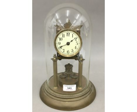 An Anniversary clock under a glass dome