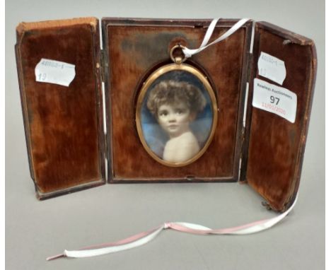 A cased miniature portrait of a child