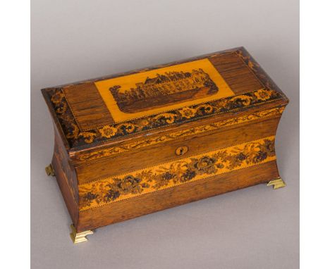 A Victorian Tunbridgeware tea caddy, of waisted rectangular form, the hinged lid centred with a stately home, the fitted inte