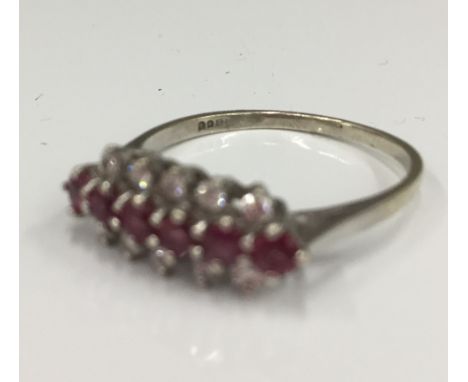 A 9 ct white gold diamond and ruby ring (2.2 grammes total weight)