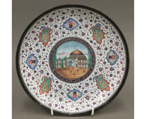 A Persian enamel decorated dish