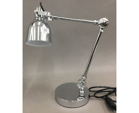 A chrome desk lamp