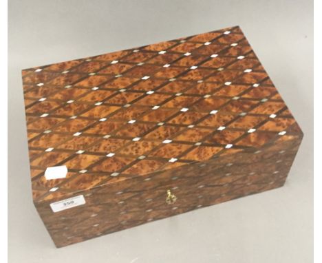A mother-of-pearl inlaid burrwood box
