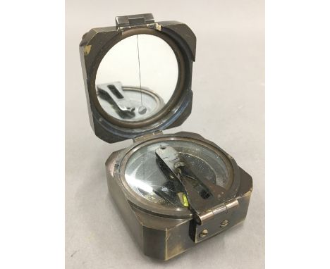 A brass cased compass