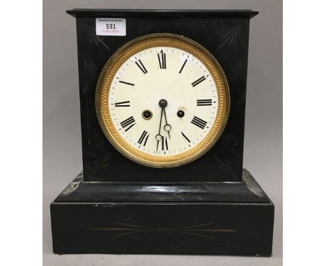 A Victorian black slate mantle clock