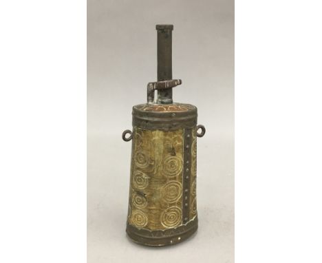 A 19th century Tibetan carved horn powder flask