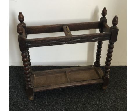 A Victorian carved oak stick stand