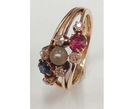 An unmarked gold ruby, sapphire, diamond and pearl ring (4.3 grammes total weight). Ring size L/M.