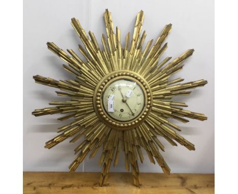 A gilt sun burst clock