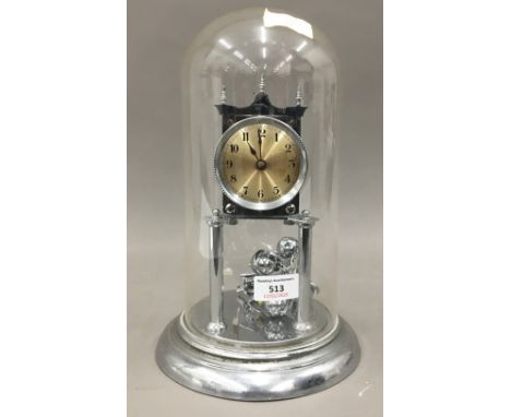 An Anniversary clock under a glass dome